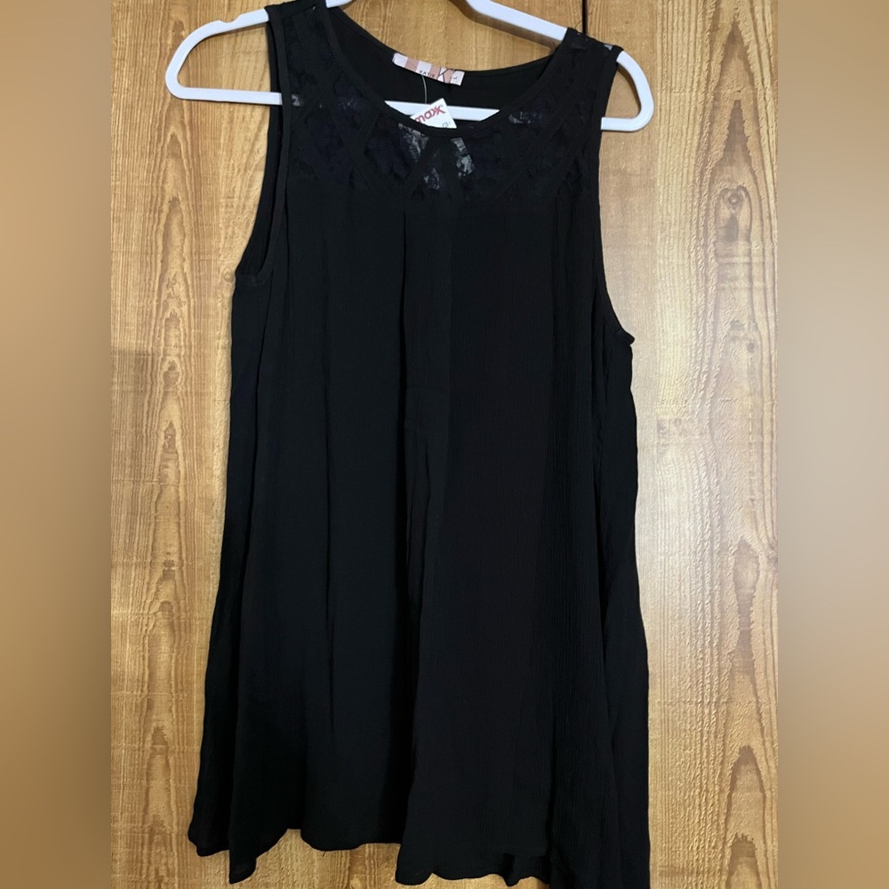 Large black sleeveless blouse with lace deta and open back detail